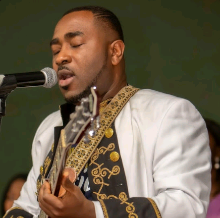A man singing into a microphone