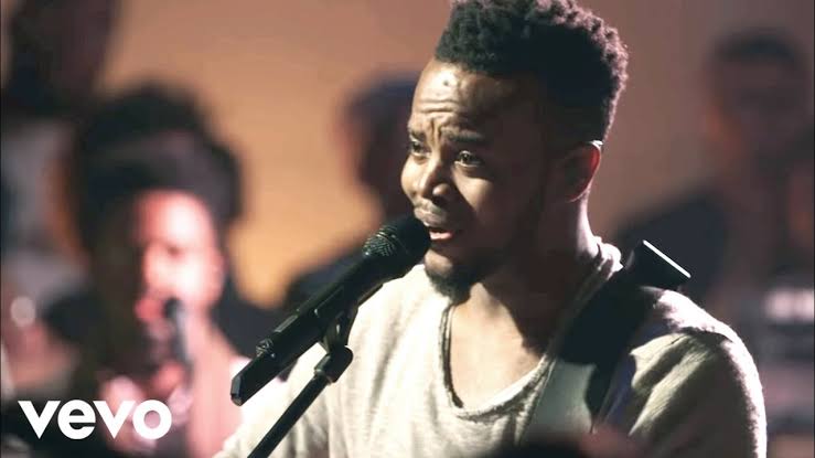 A man singing into a microphone